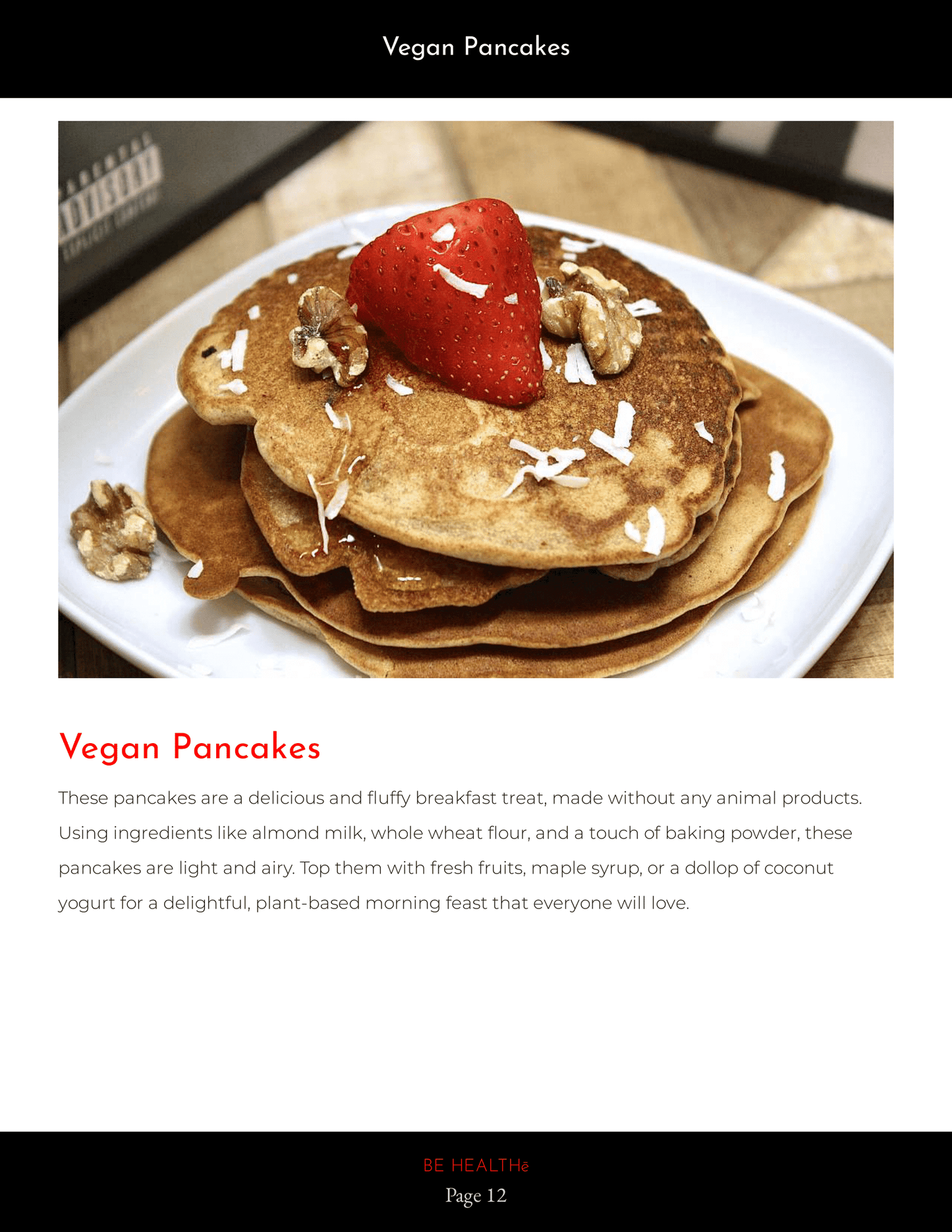 Pancakes with walnuts and a strawberry on top. 